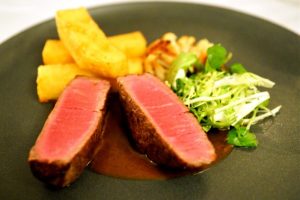 Beef fillet with triple cooked chips, watercress, lemon roasted cauliflower